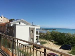 a white house with the ocean in the background at La casa di Lelè - BIKE CLUB - in Termoli