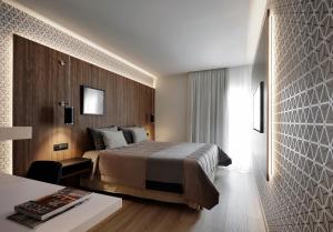 Кровать или кровати в номере Evridiki