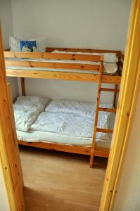 a couple of bunk beds in a room at Ferienhaus Erholung Pur in Boltenhagen
