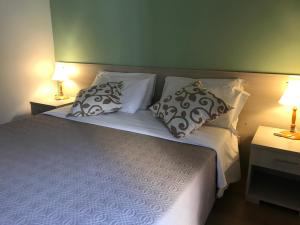 מיטה או מיטות בחדר ב-Papali