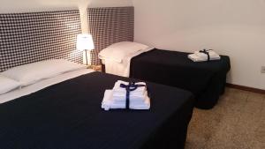 Postel nebo postele na pokoji v ubytování In Vacanza da Marinella