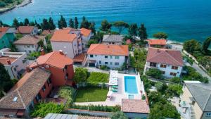 an aerial view of a town with houses and the ocean at Villa Oria in Pula