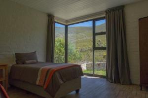 Ένα ή περισσότερα κρεβάτια σε δωμάτιο στο Phillipskop Mountain Reserve