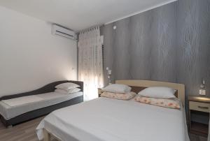 Postel nebo postele na pokoji v ubytování Villa Marija
