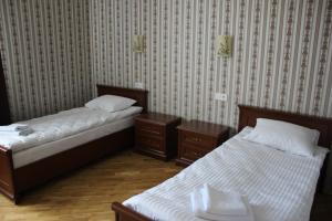 Posteľ alebo postele v izbe v ubytovaní Complex Zolota Pidkova