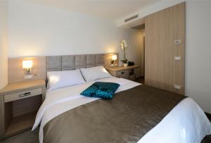 Ein Bett oder Betten in einem Zimmer der Unterkunft Grand Hotel Adriatic II