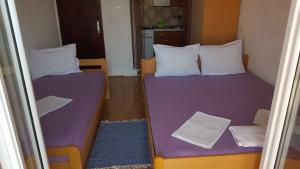 Postel nebo postele na pokoji v ubytování Apartments Alissa