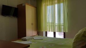 Postel nebo postele na pokoji v ubytování Apartments Alissa