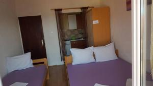 Postel nebo postele na pokoji v ubytování Apartments Alissa