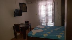 Postel nebo postele na pokoji v ubytování Apartments Alissa