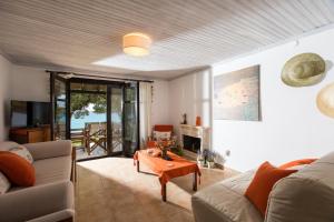 a living room with a couch and a table at Ktima Delmare Pantazara in Nea Skioni