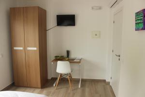TV a/nebo společenská místnost v ubytování Infusion