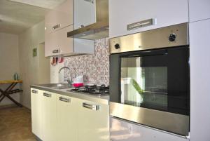 Kjøkken eller kjøkkenkrok på Villetta Gessica