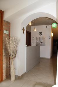 a kitchen with a vase of flowers in a hallway at Valle Di Francesco in Assisi