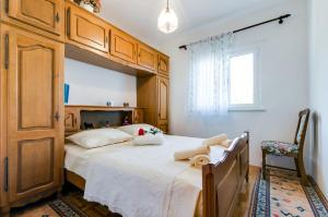 Posteľ alebo postele v izbe v ubytovaní Apartmani Prkačin