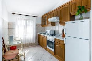 Kuchyňa alebo kuchynka v ubytovaní Apartmani Prkačin