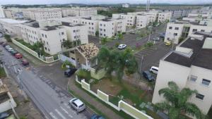 an aerial view of a city with cars and buildings at Rio das Ostras Apartment in Rio das Ostras