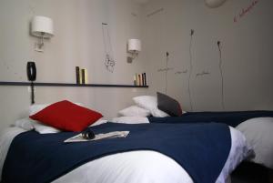 Cama ou camas em um quarto em Hotel de la Placette Barcelonnette