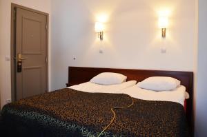 Postel nebo postele na pokoji v ubytování Gotthard Residents