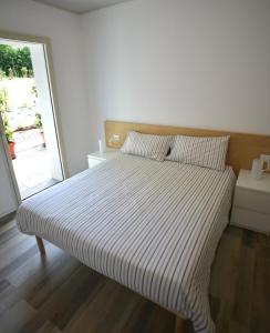 A bed or beds in a room at Il Mulin Vecchio