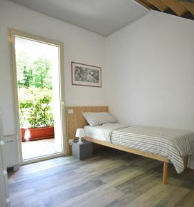Ένα ή περισσότερα κρεβάτια σε δωμάτιο στο Il Mulin Vecchio