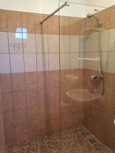Kúpeľňa v ubytovaní Pálma Apartmanház Siófok