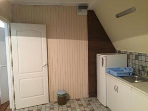 Kuchyň nebo kuchyňský kout v ubytování Pálma Apartmanház Siófok + 37 fotografií