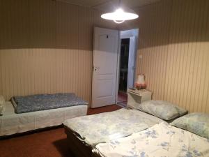 Posteľ alebo postele v izbe v ubytovaní Pálma Apartmanház Siófok