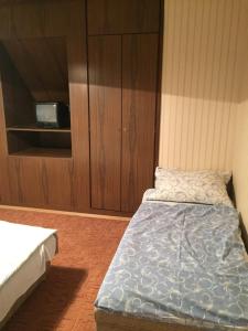 Posteľ alebo postele v izbe v ubytovaní Pálma Apartmanház Siófok