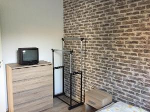 Televízia a/alebo spoločenská miestnosť v ubytovaní Pálma Apartmanház Siófok