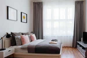Posteľ alebo postele v izbe v ubytovaní Apartment Gesse Jirsikova