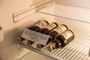 a group of bottles of wine in a refrigerator at Ferienwohnung Hartmann in Winterberg