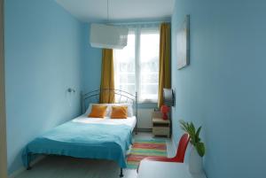 
Łóżko lub łóżka w pokoju w obiekcie Grande Sopotiera
