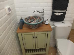 a bathroom with a sink and a toilet at Central old stone Jerusalem apartment in Jerusalem