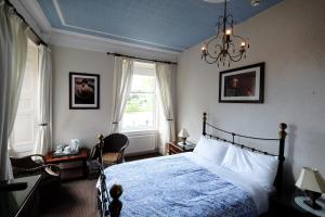 Llit o llits en una habitació de Talisker Guest House