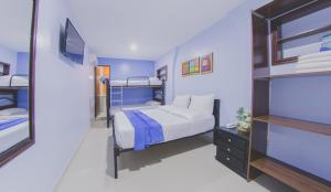 Postel nebo postele na pokoji v ubytování Azuán Suites Hotel By GEH Suites