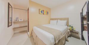 Postel nebo postele na pokoji v ubytování Azuán Suites Hotel By GEH Suites