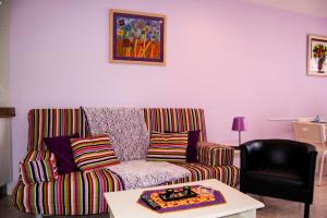 a living room with a couch and a table at Playa De Arnadal Isla in Isla