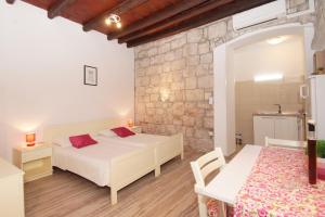 Posteľ alebo postele v izbe v ubytovaní Apartment Chupa