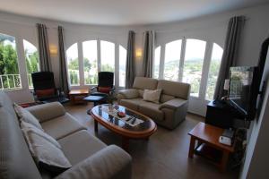 A seating area at El Atarceder-6 - sea view villa with private pool in Benissa
