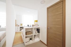 a room with a door leading into a bedroom at Camplus Pamplona in Pamplona