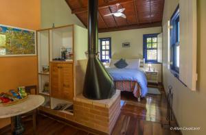 Cama ou camas em um quarto em Pousada Ribeirao da Floresta