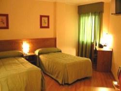 Postel nebo postele na pokoji v ubytování Hotel Costa Verde