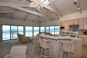 a large kitchen with a view of the ocean at Villa Vista in Santa Cruz
