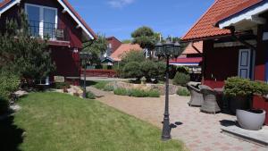 a street light in the middle of a yard at Harmony Park Nida House in Nida