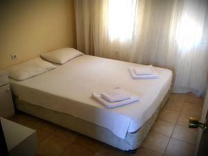 
Een bed of bedden in een kamer bij Ali Babam Apart Hotel
