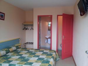 Postel nebo postele na pokoji v ubytování Tour Hôtel