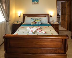 Voodi või voodid majutusasutuse Seashell Beach Villa toas