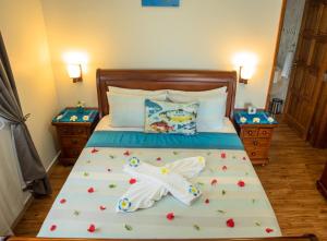Voodi või voodid majutusasutuse Seashell Beach Villa toas