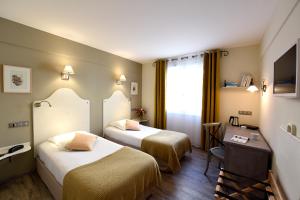 Voodi või voodid majutusasutuse The Originals Boutique, Hôtel du Parc, Cavaillon toas